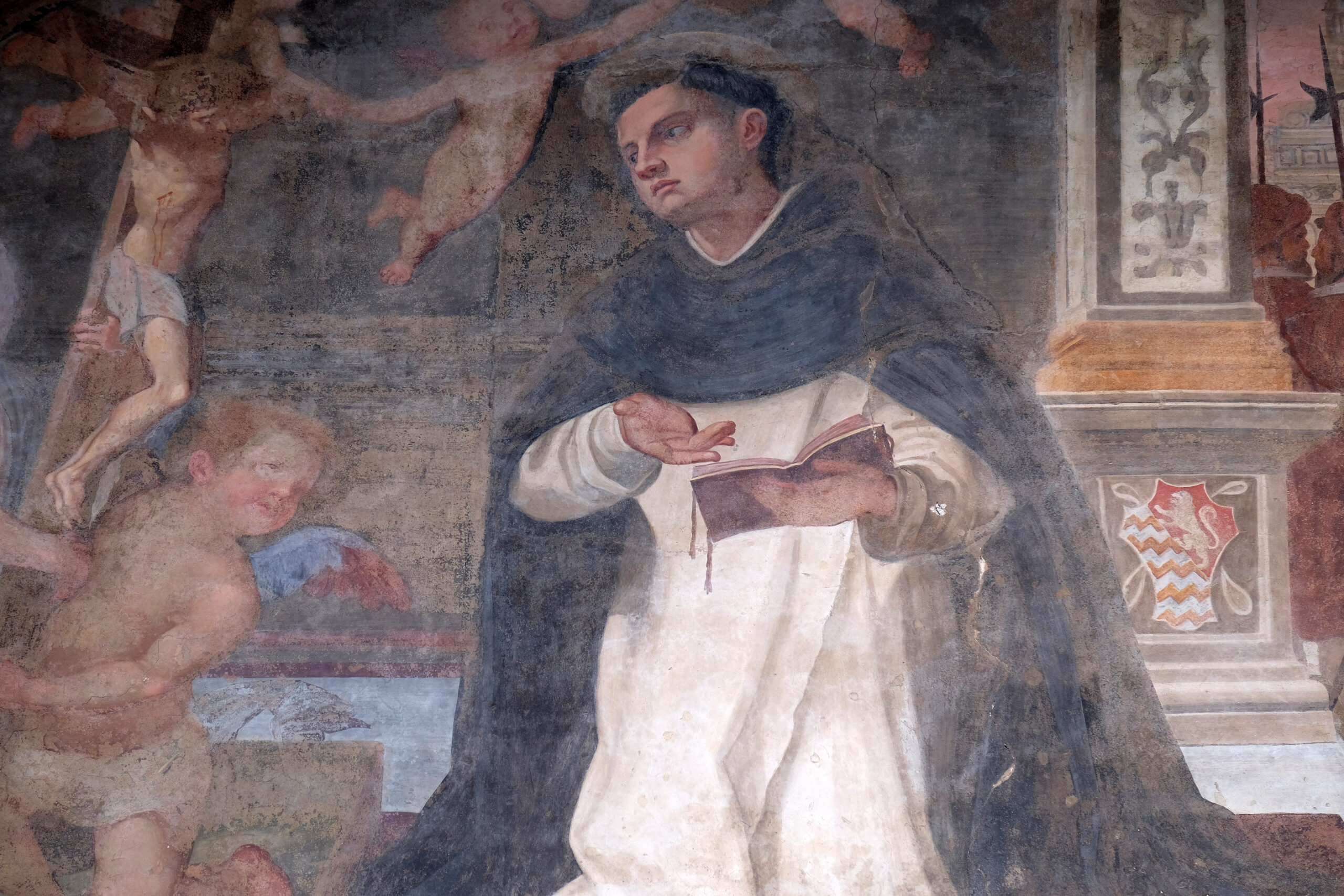 The lunette of one of the side doors depicting St. Thomas Aquinas, detail of the facade of the Church of Santa Maria Novella in Florence, Italy